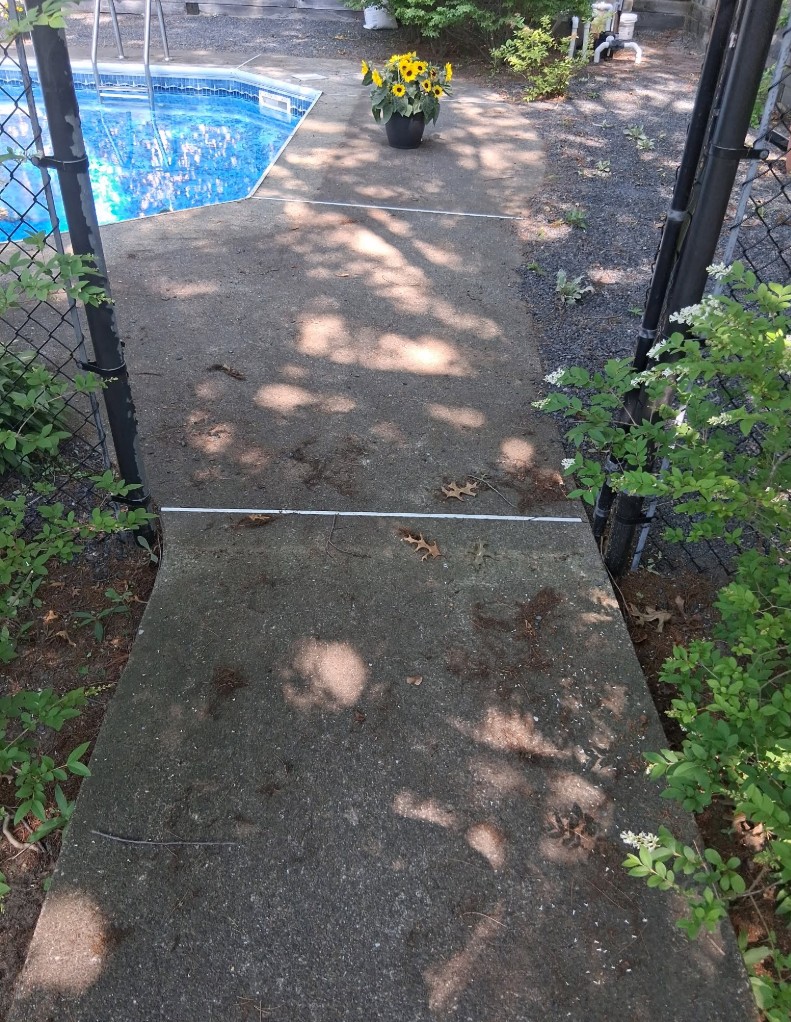 Pool walkway before pressure washing